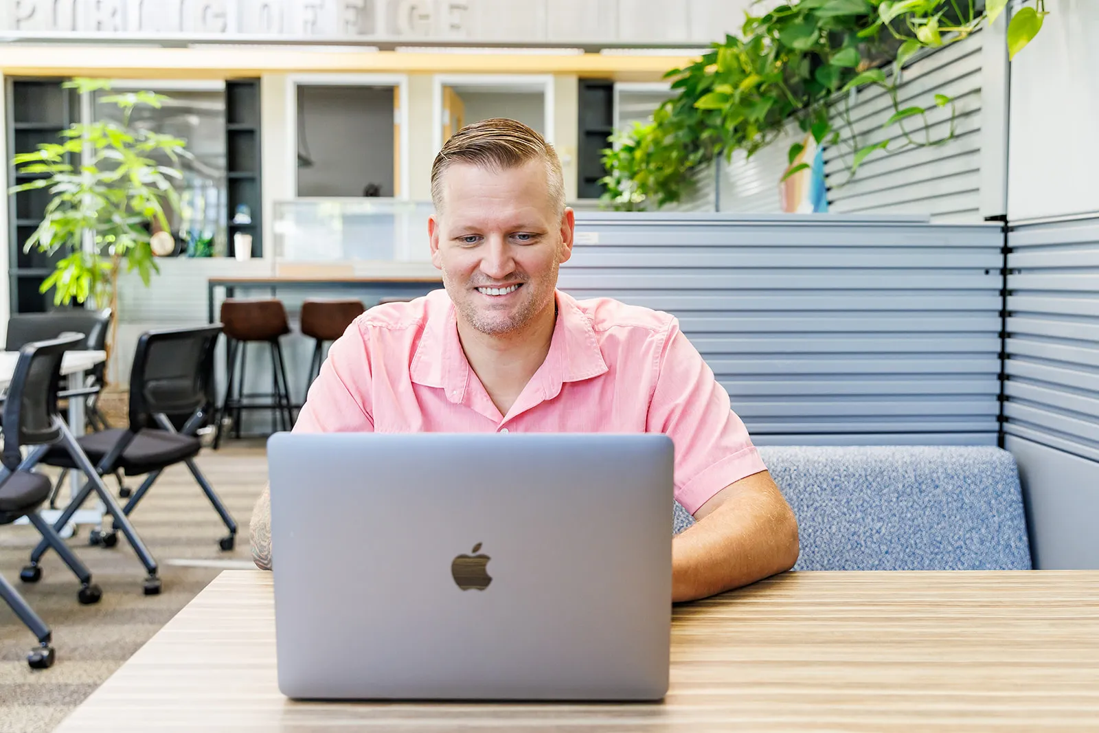 Wesley Cable reviewing client marketing results at his workspace