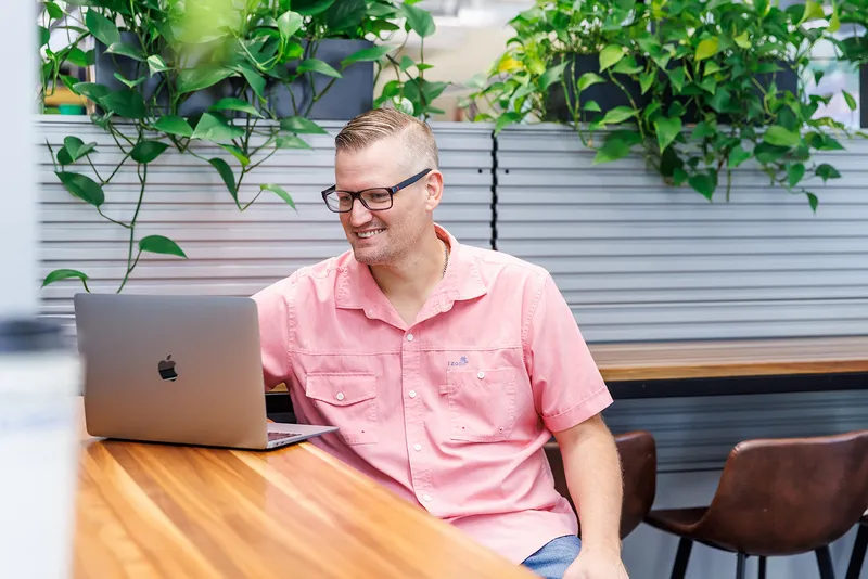 Wesley Cable, PipelineOS founder, working on a client website